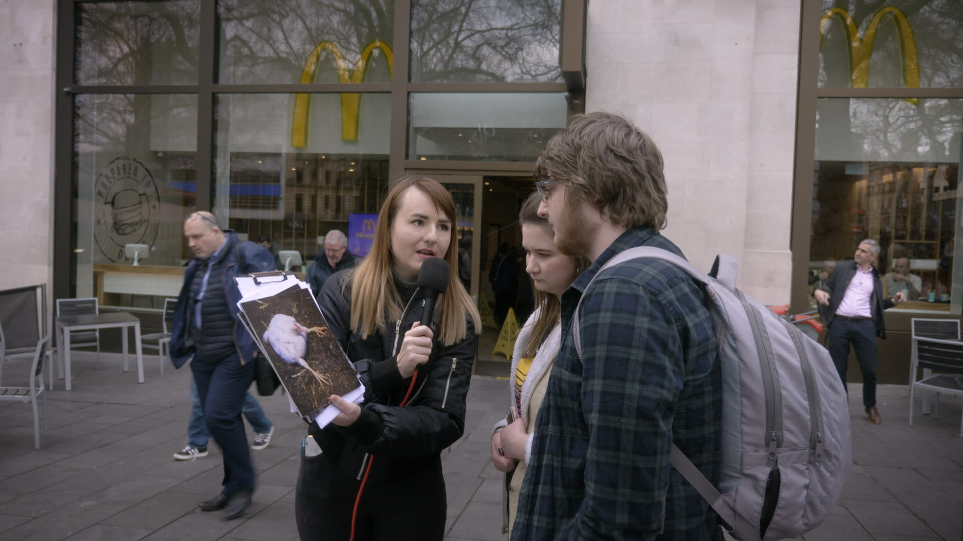 Volunteer interviewing the public about mcdonalds 
