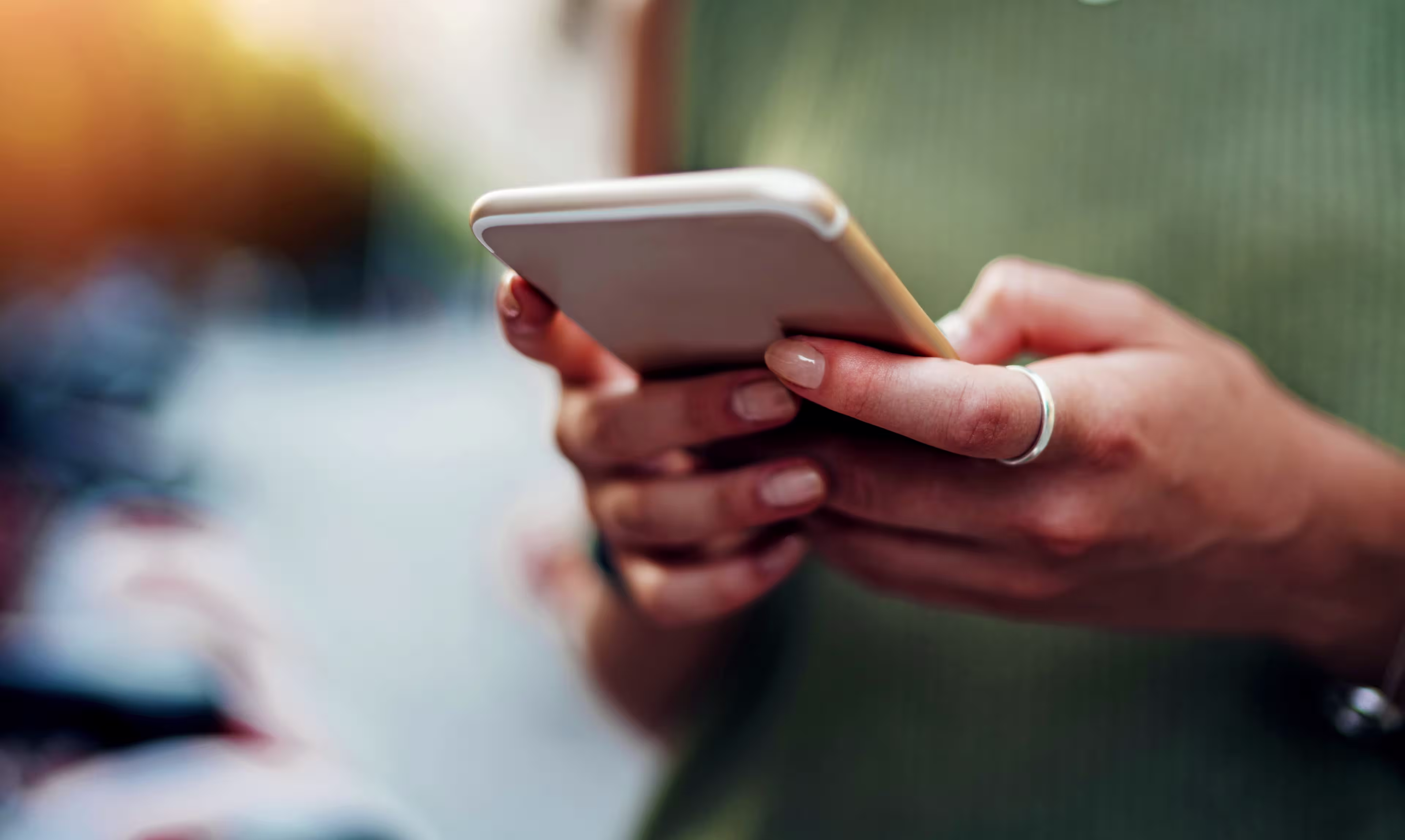 woman-holding-phone-cropped