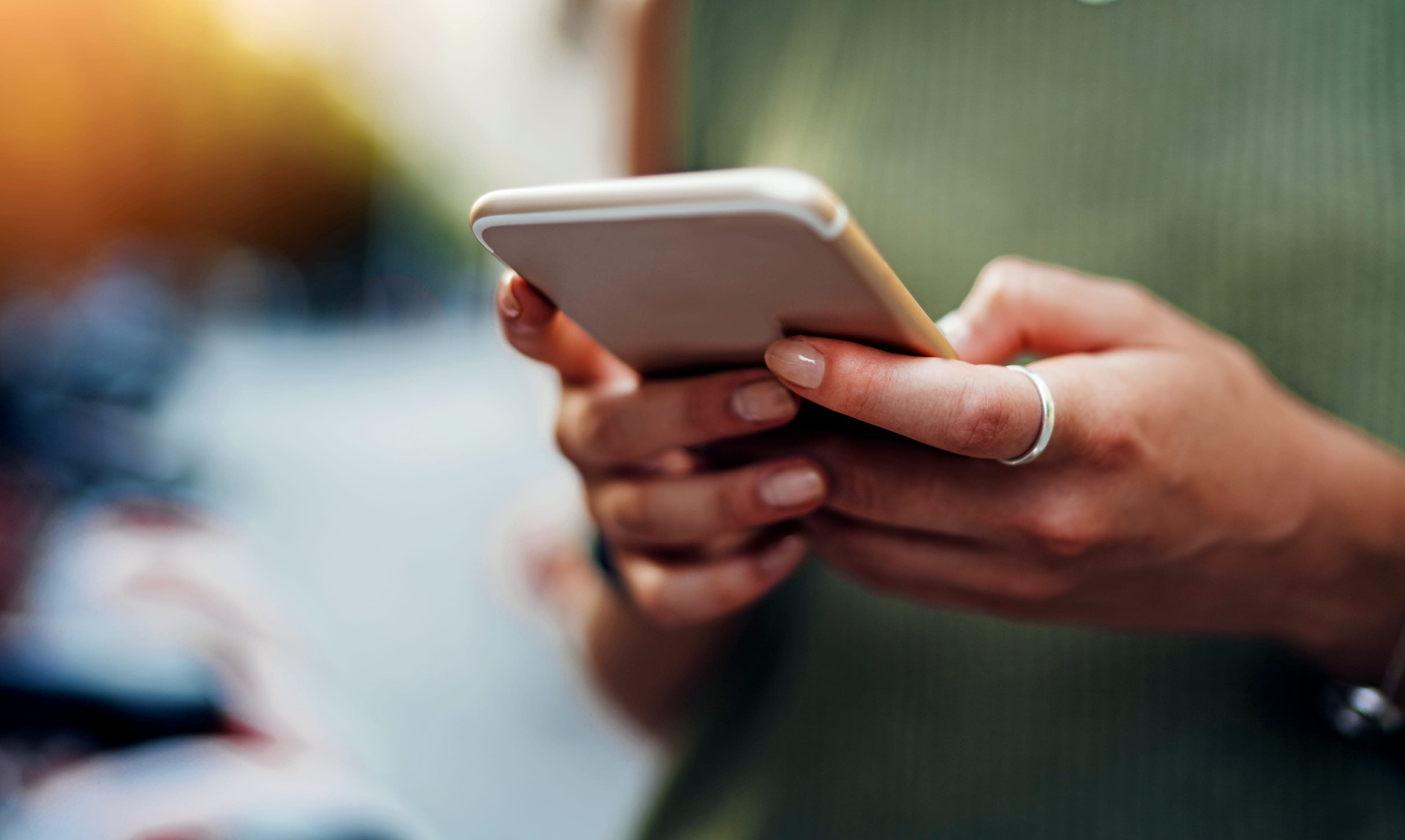 woman-holding-phone-cropped