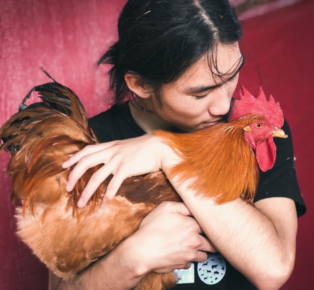 Ryuji with a rooster named Josee