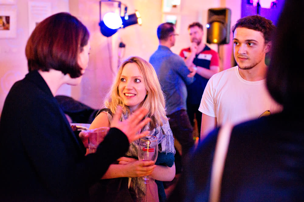 Vicky talks to volunteers at launch party