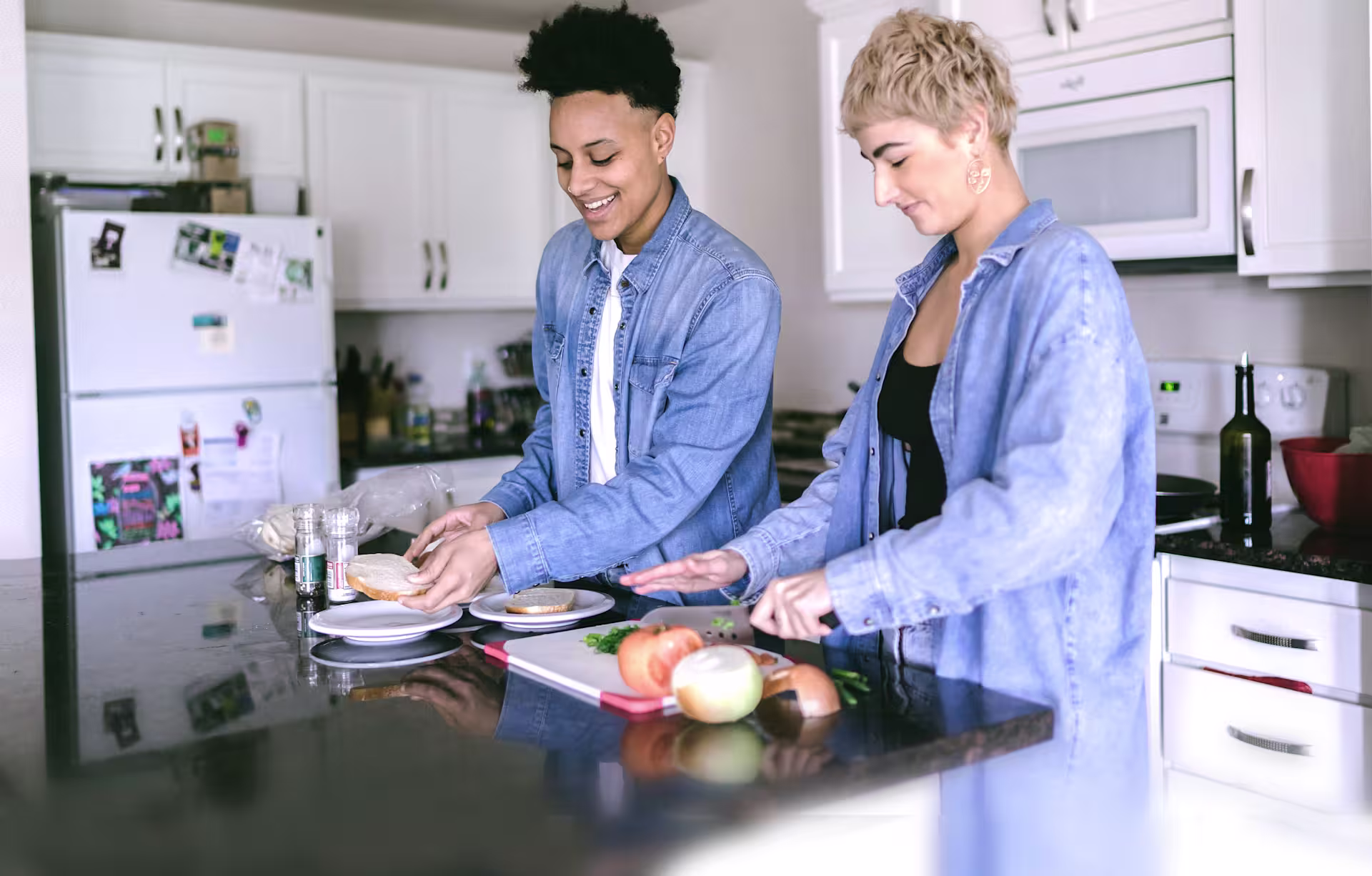 two-young-people-in-denim-prepping-food