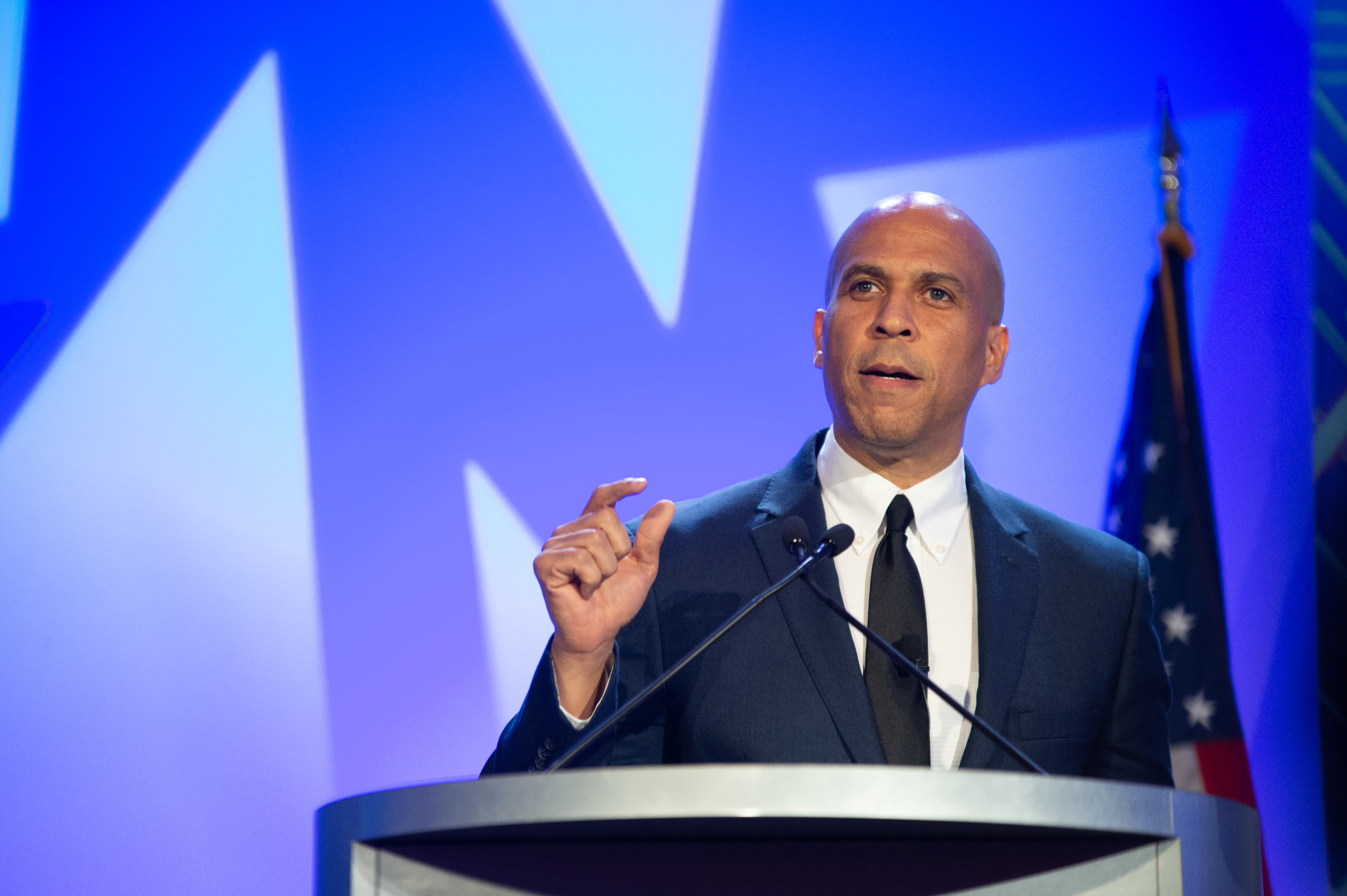 Senator Cory Booker standing at a podium