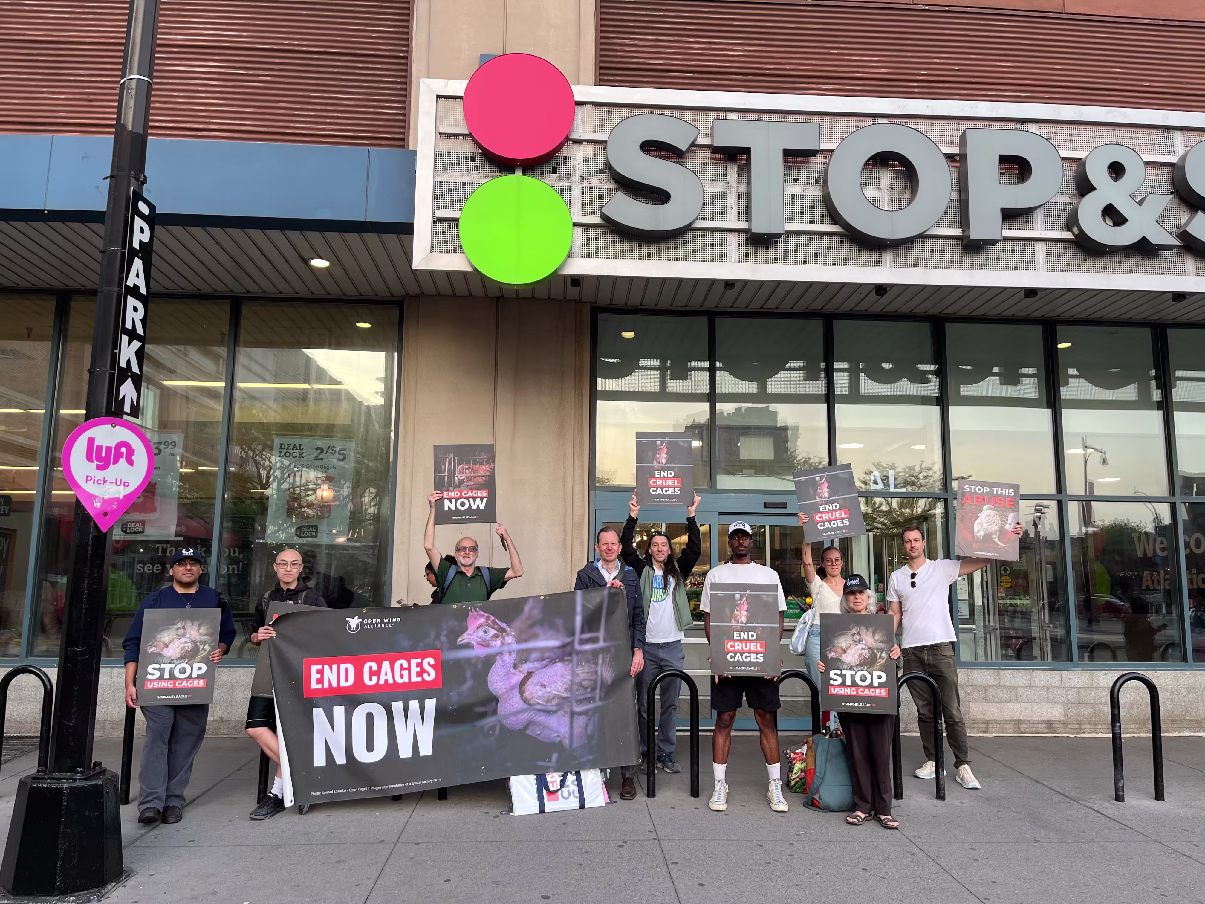People protesting cages outside Stop & Shop