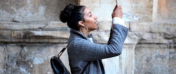 Woman in taking a photo using her phone