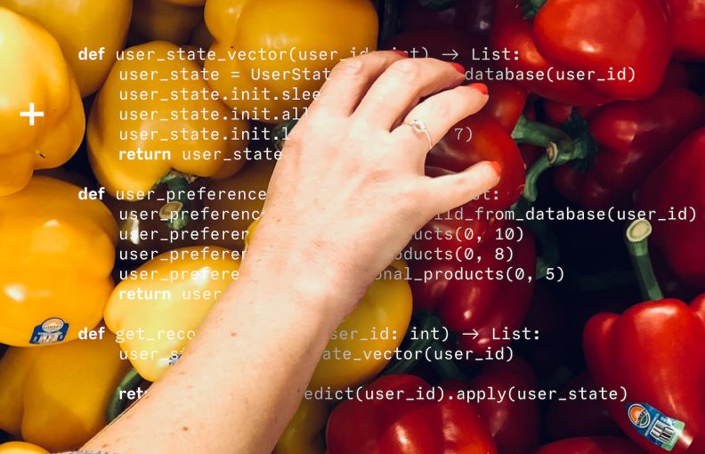 A hand picking bell peppers, with computer code in the background