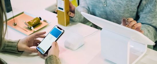 Contactless payment being used at the cashier