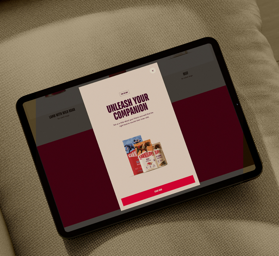 A tablet on a sofa showing a food quiz to calculate your pet's food needs
