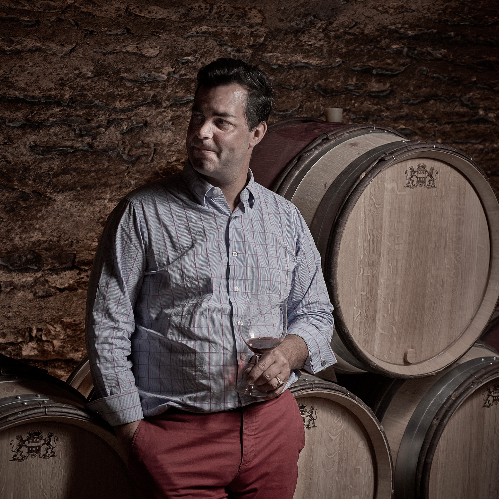 Man sitting on wine casks