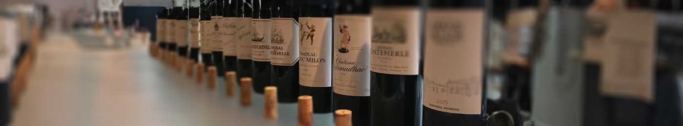 wine bottles with corks in froont of them