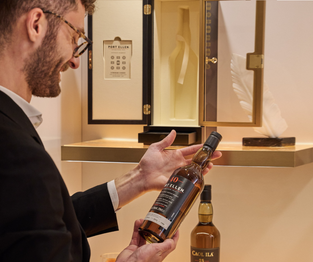 man holding a rare whisky bottle