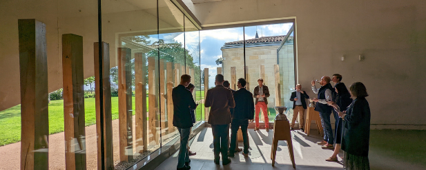 Small group of people in a room drinking wine