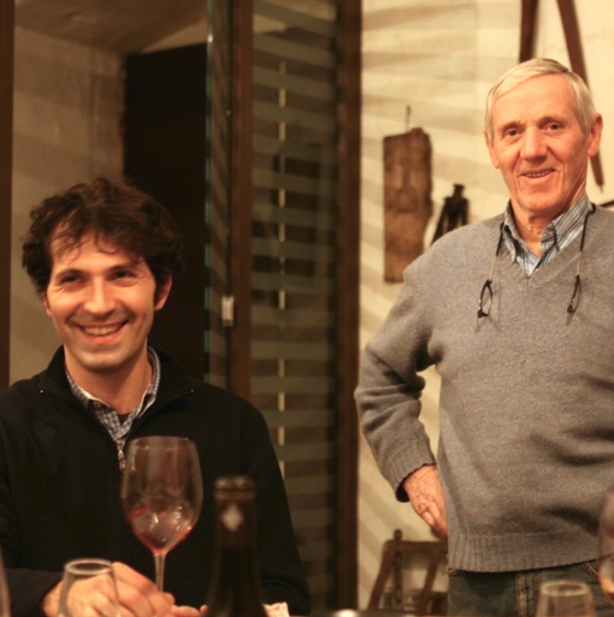 father and son drinking wine