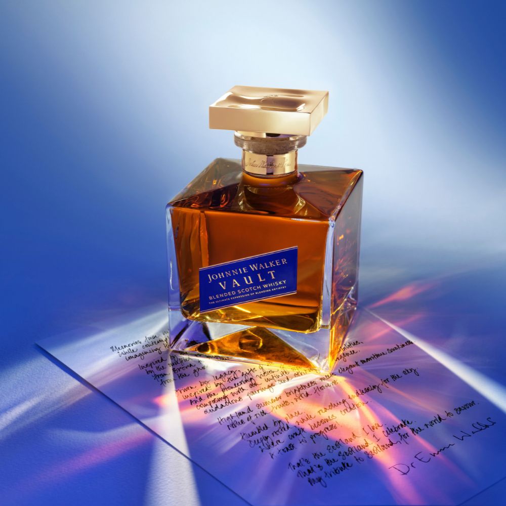 Whisky bottle posed on handwritten note
