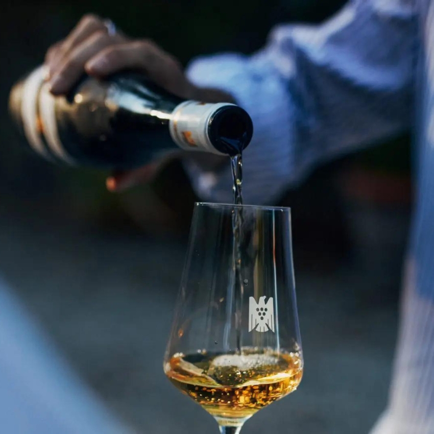 Bottle of Riesling being poured into glass