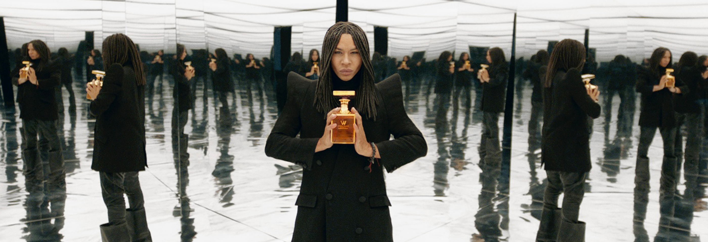 Olivier with bottle in glass room