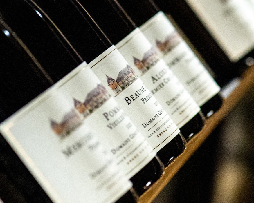 A barrel with a red stripe storing wines