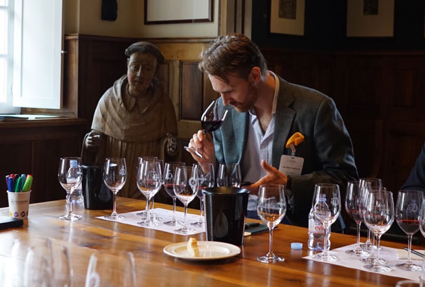 Man smelling a glass of wine