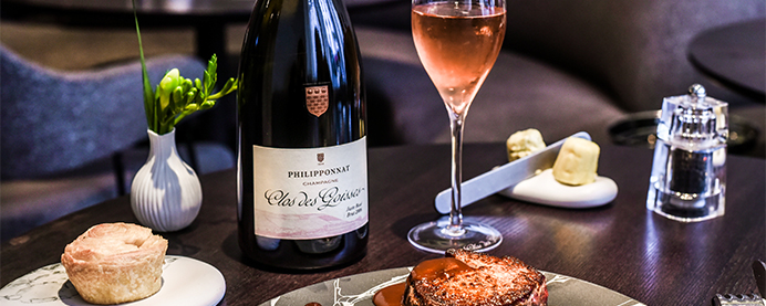Philipponnat Clos des Goisses on a table with food