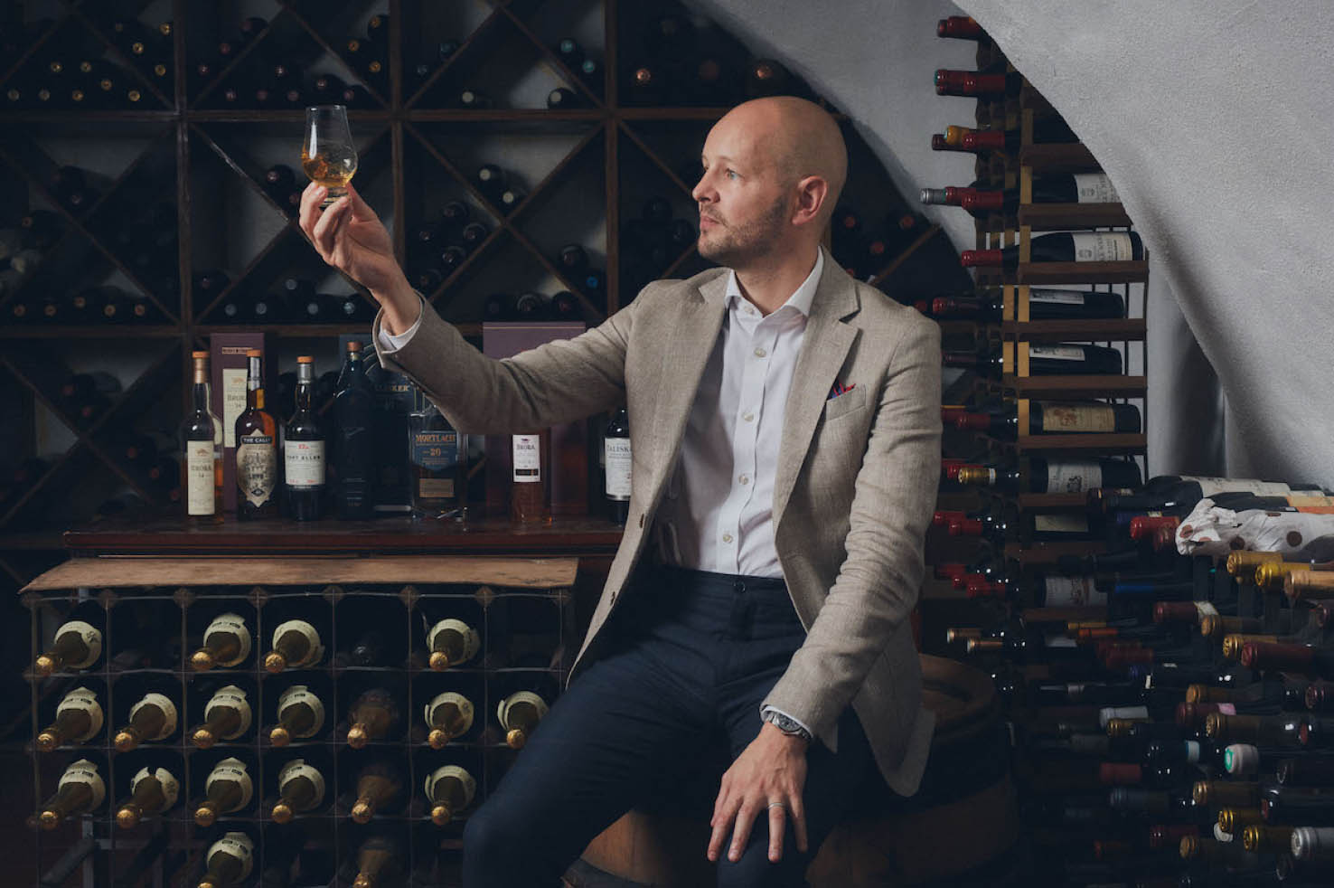 Man sitting with a glass of wine