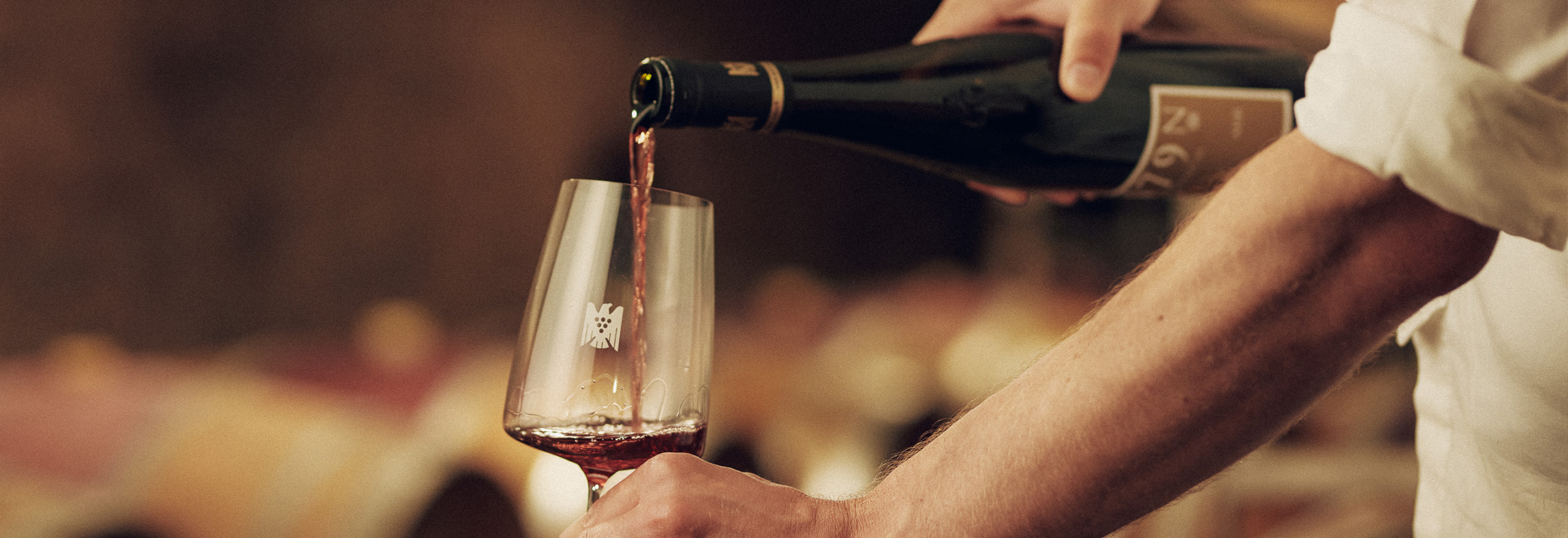 Poured bottle of wine into glass
