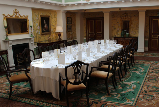 A set dining table with white tablecloth