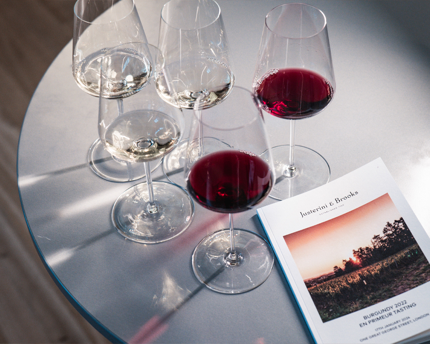 Wineglasses on a table filled with red and white wine