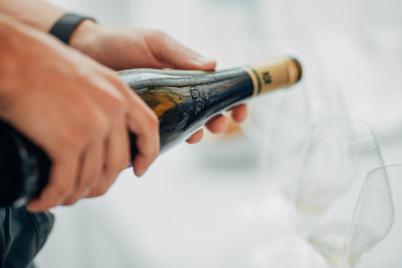 pouring alcohol into a glass
