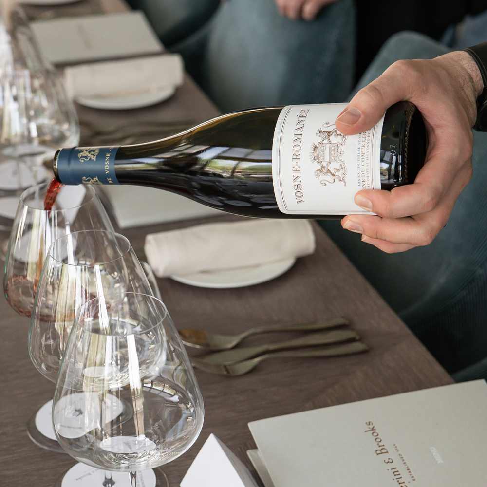 Bottle of Liger Belair Vosnee Romanee being poured