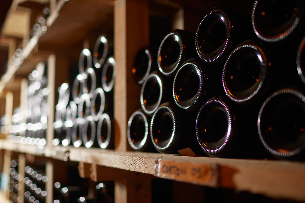 bottles stacked in cabinet