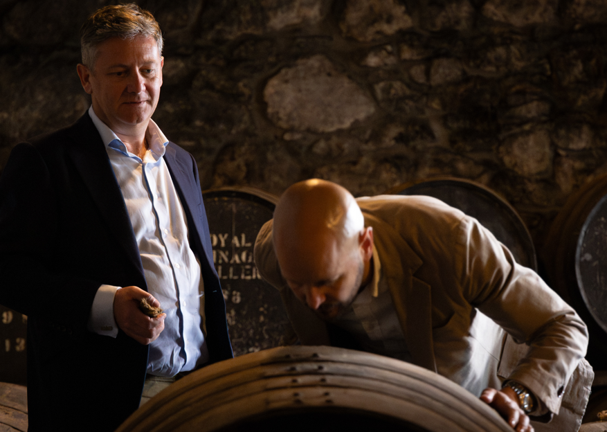 man with whisky barrel