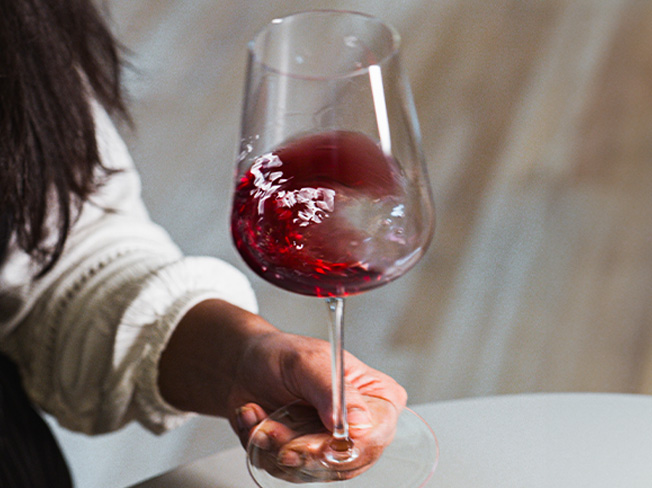 Red Burdungy being swirled in a glass