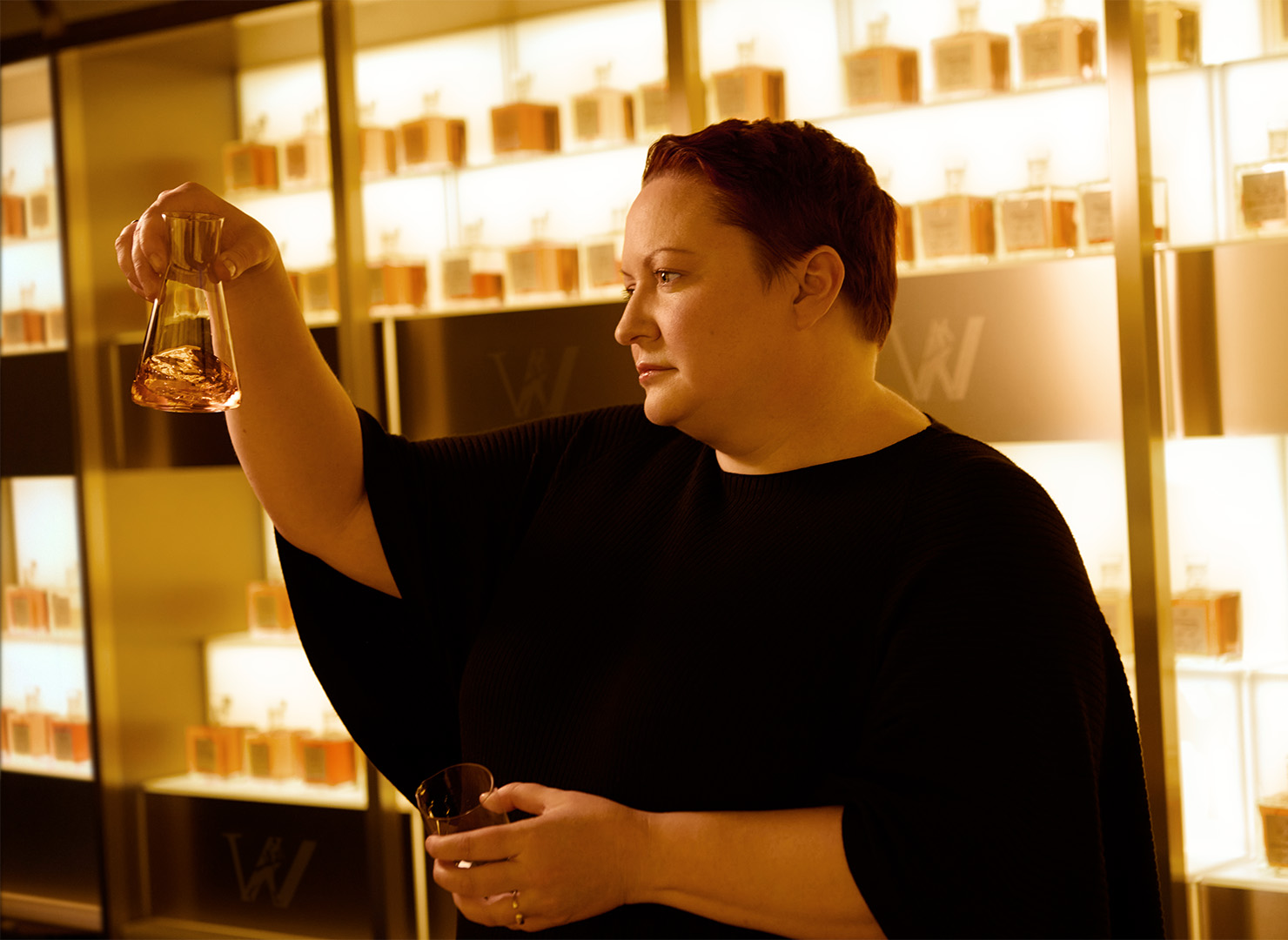 Emma Walker swirling whisky in a glass