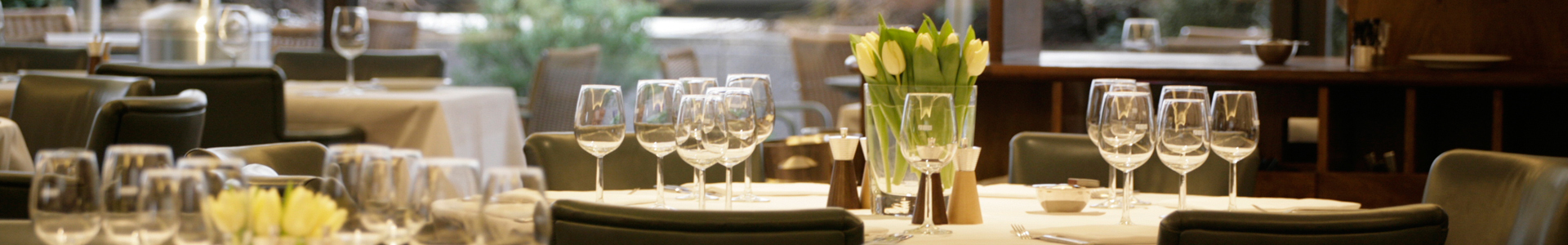 Five wine bottles with their labels displayed