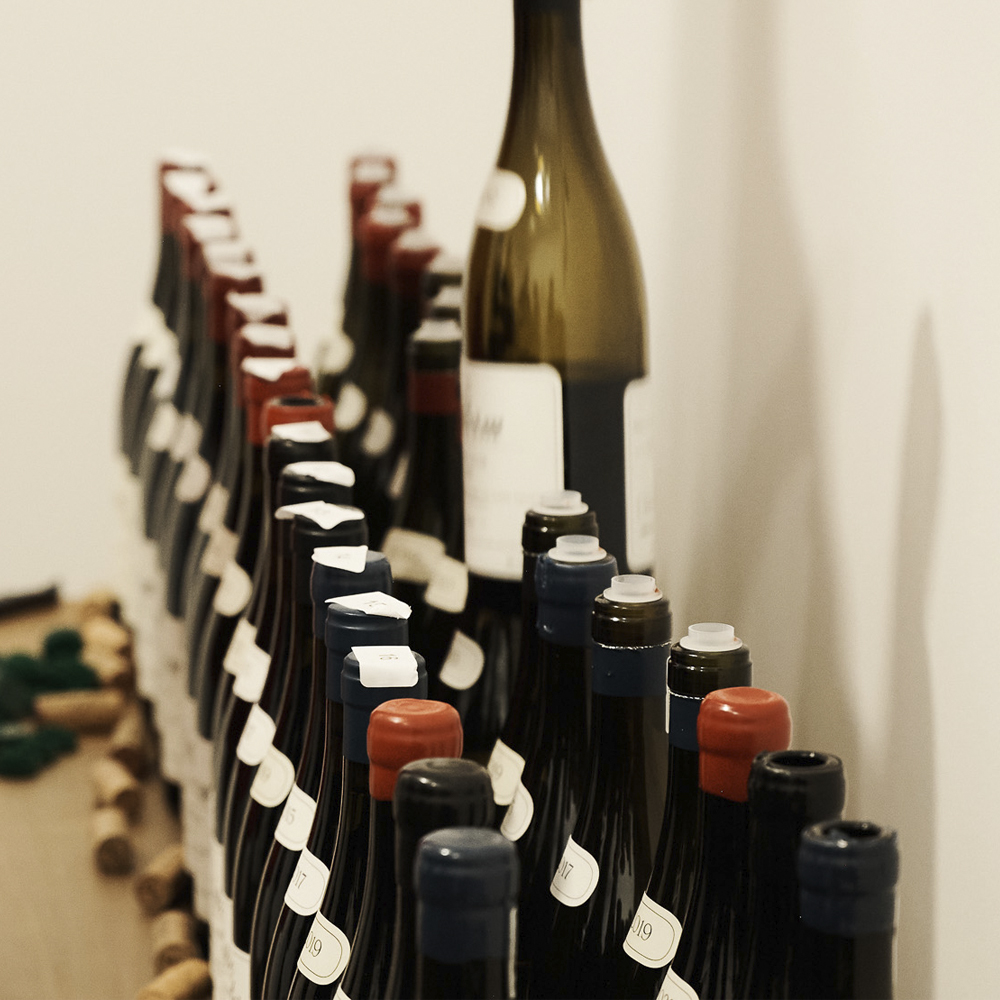 selection of bottles being lifted