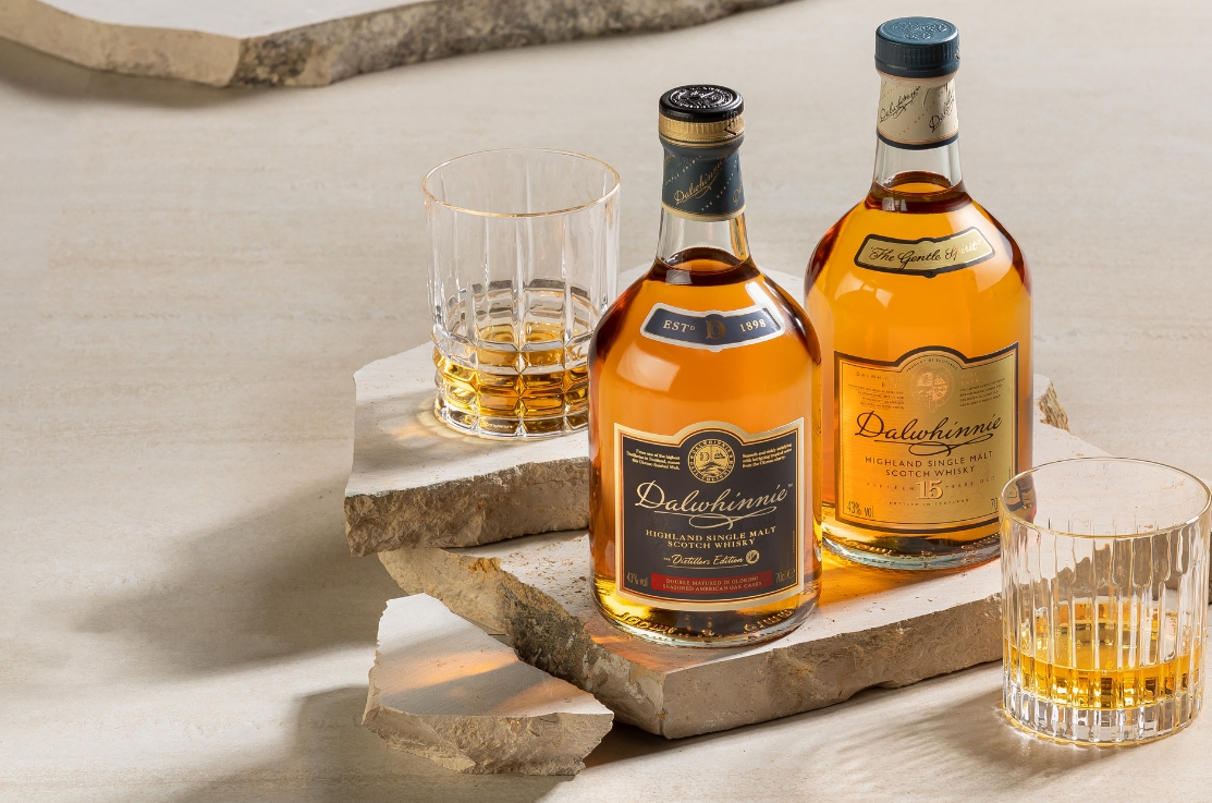 Whisky Bottle On Wooden Table