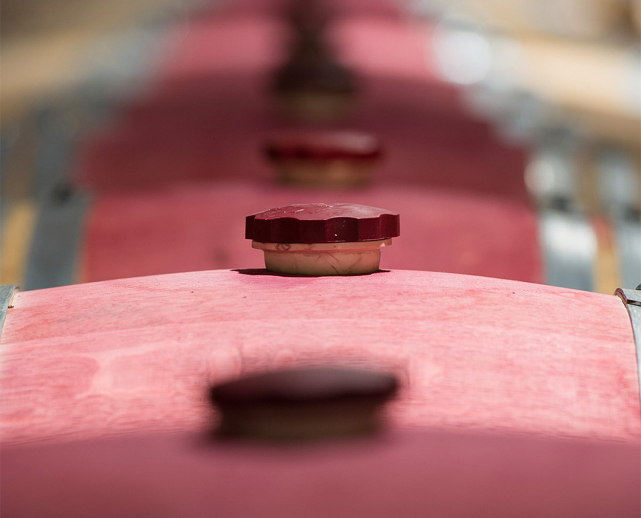 A wine barrell with red accents