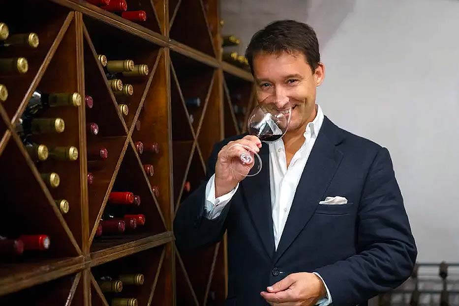 Chadwick smelling a glass of wine