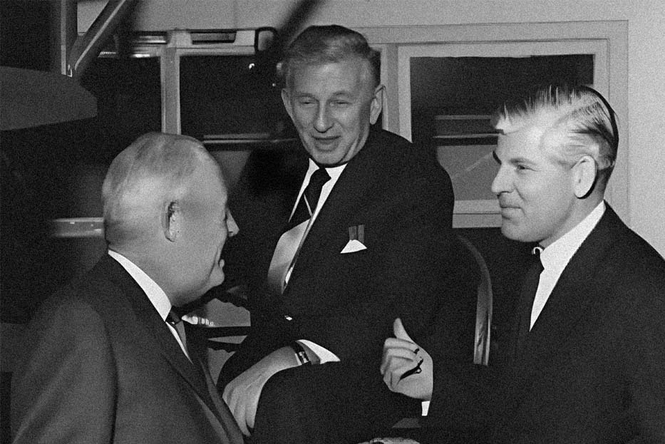 Three men next to a J&B delivery