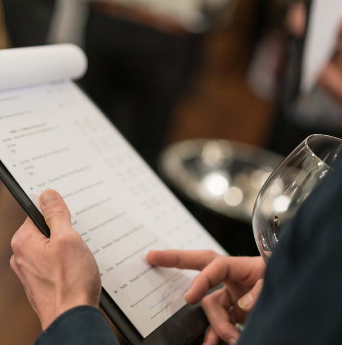 woman's hands pointing on papers