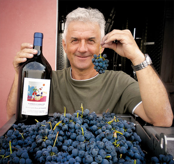 Man holding wine and grapes