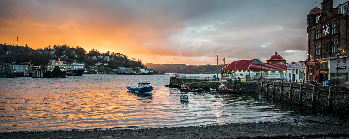 Oban bay during sunset with boats on the port