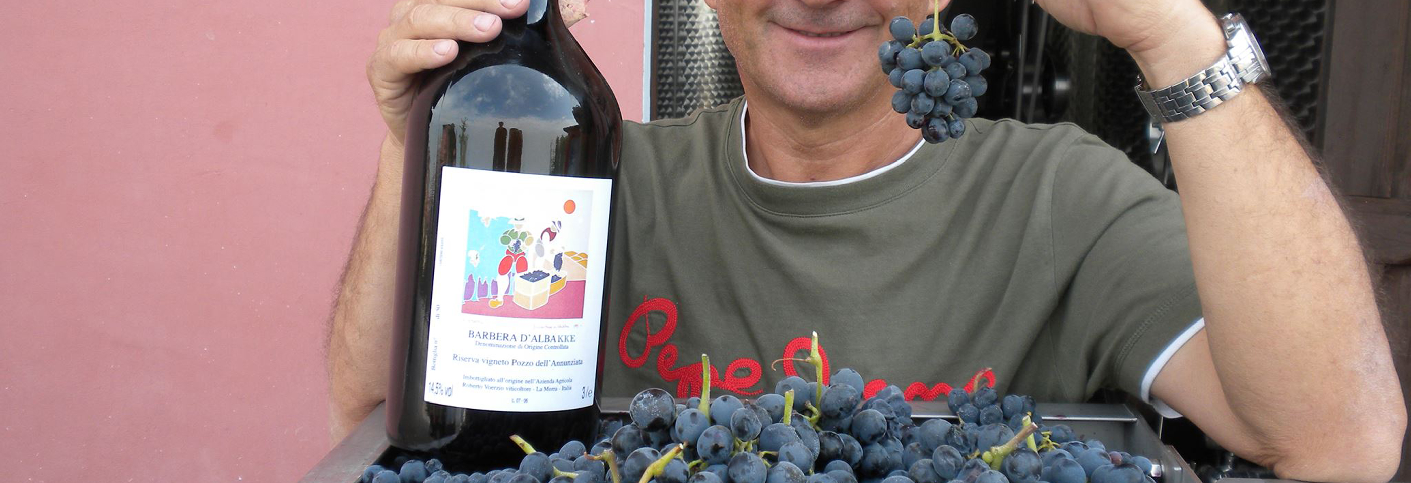 holding bottle of wine