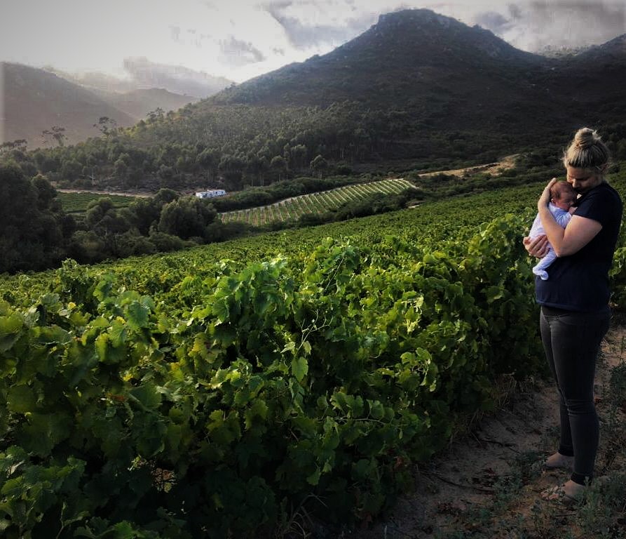 Woman holding baby on mountain