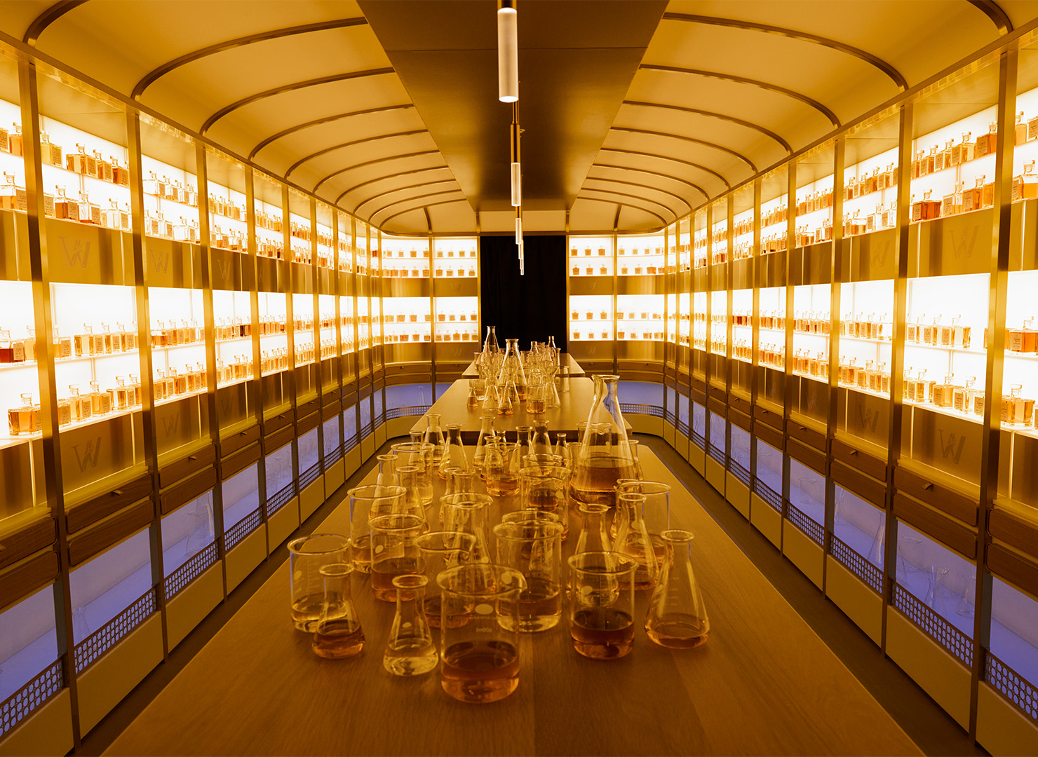A room with flasks of whiskies on a table