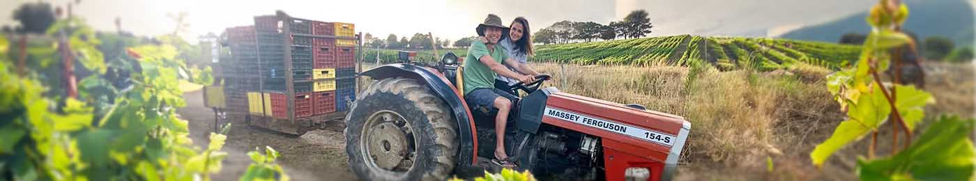 man and woman on a tractor