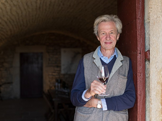 Marquis d'Angerville holding a wine