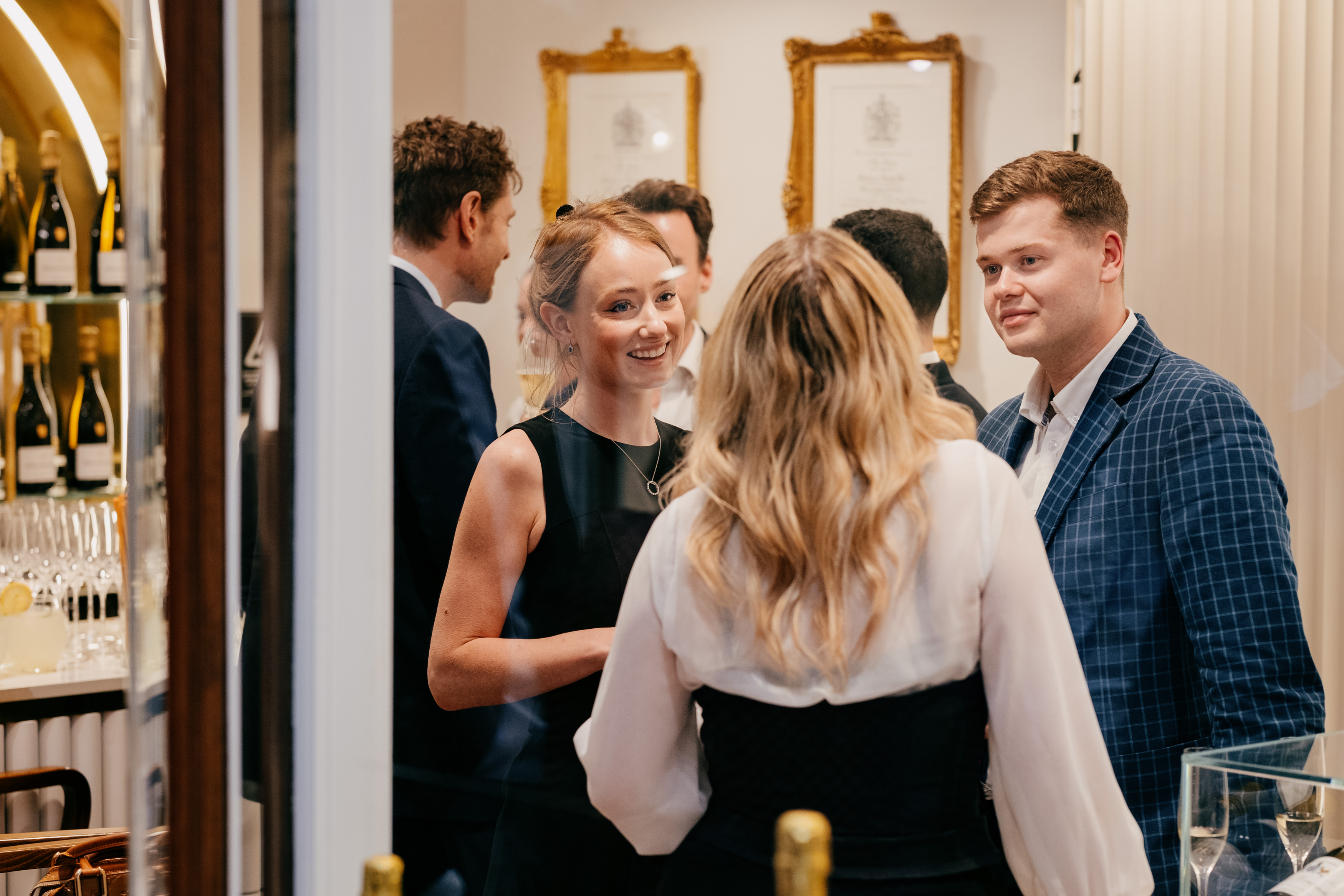 Group of people mingling in an elegant room