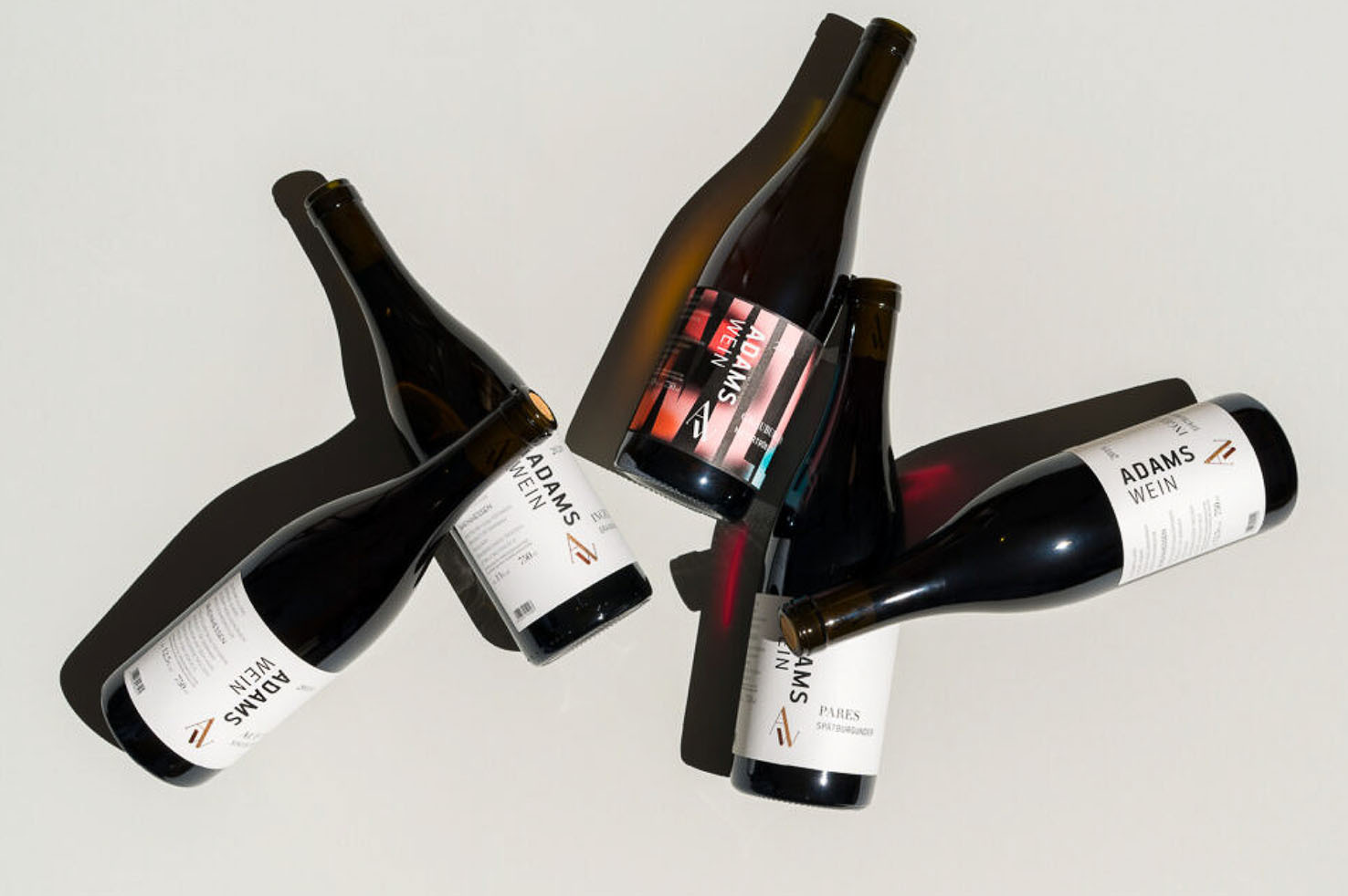 four wine bottles top down view arranged in a pattern