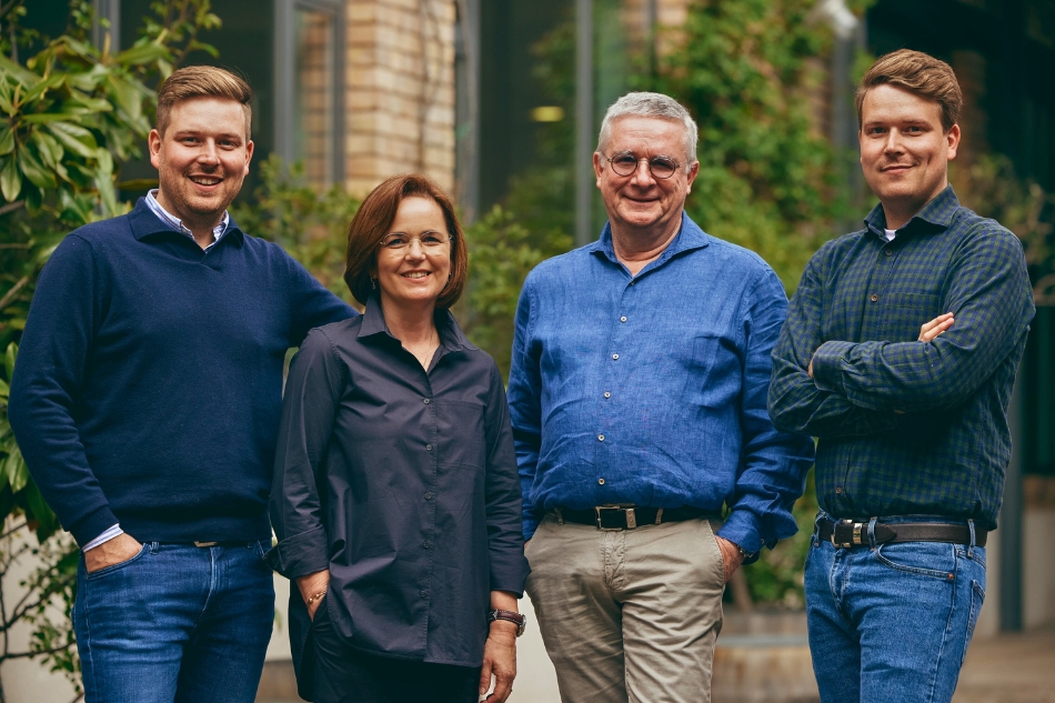 Four people stood, smiling at the camera, Okonomierat Rebholz